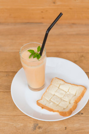 Milk melon Smoothie in glass with Roast breadの写真素材