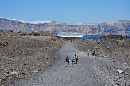 Santorini island, Greece, August 13, 2012 -Tourist excursion to the volcanic crater on the Santorini island, Greece のeditorial素材