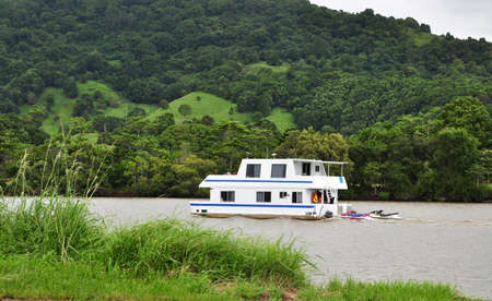 Australia, Photo taken at 9th  January 2010-A house boat floating down the riverのeditorial素材