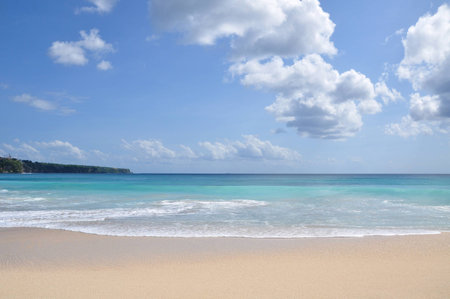 Beautiful calm seashore under cloud line skyの写真素材