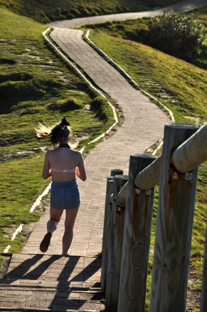 Byron bay Australia, Photo taken at January 2011- A tourist walking back  from the beach its a walkway  from a park to beach of cape Byron のeditorial素材