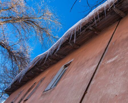 Icicles on the roofの写真素材