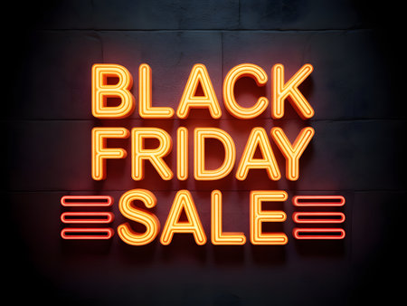 Black friday sale neon sign glowing on a dark brick wall, advertising a major shopping event and discountsの素材