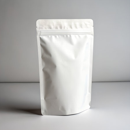 Blank white stand up pouch bag for packaging products, isolated on white backgroundの素材