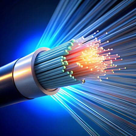 Fiber optic cable with glowing light strands emanating outwards, representing highspeed data transmissionの素材