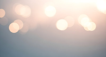Soft bokeh lights in warm sunlight with a gentle gradientの素材