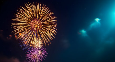 Golden fireworks illuminate the night sky, creating a dazzling display of light and color in the darknessの素材