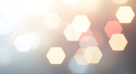 Abstract hexagon bokeh lights background with soft colors, creating a dreamy and ethereal atmosphereの素材