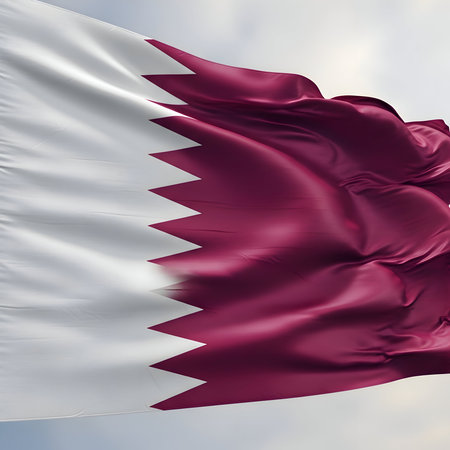 Realistic waving flag of qatar, a symbol of national pride and sovereignty, fluttering in the breeze against a clear sky.の素材