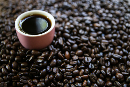 coffee cup with burlap sack of coffee beans and scoopの写真素材