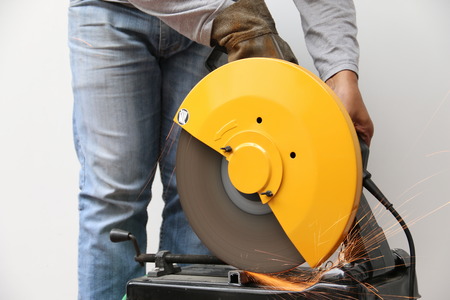 Machine cutting a metal object.の写真素材