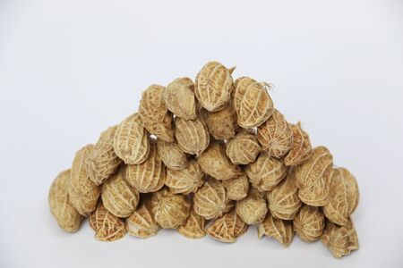 Heap of Peanuts isolated on white backgroundの写真素材