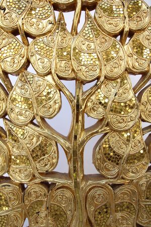 Wood carvings, gold color, white background.の写真素材