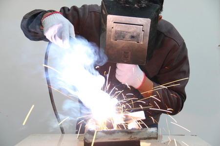 worker welding steel