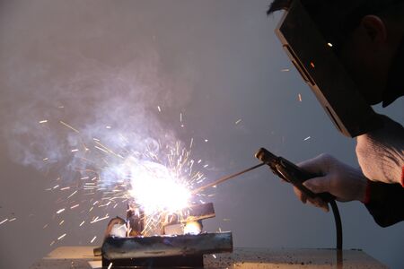 worker welding steel