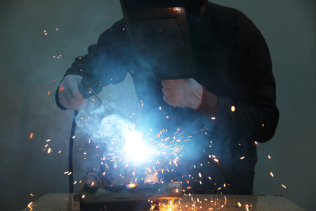 worker welding steel