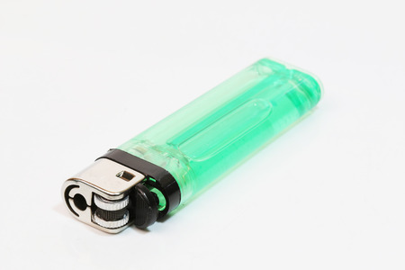 Green lighter isolated over white backgroundの写真素材