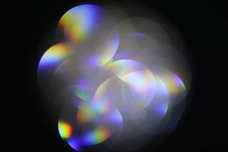 Beautiful black and white blurred lights on a dark background