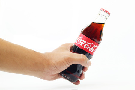 CHIANGMAI, THAILAND- May 5, 2015:Handle Coke , Coca-Cola on white background. Coca-Cola is a carbonated soft drink sold throughout the world.のeditorial素材