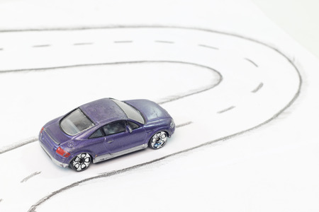 Toy car on white Street.の写真素材