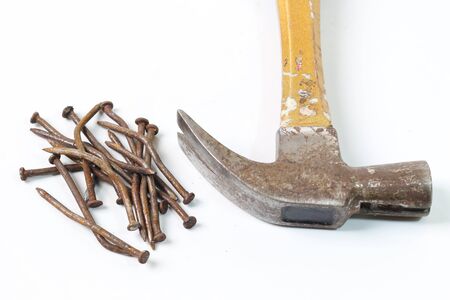 Hammers and nails on a white background.の写真素材