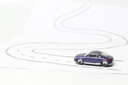 Toy car on white Street.の写真素材