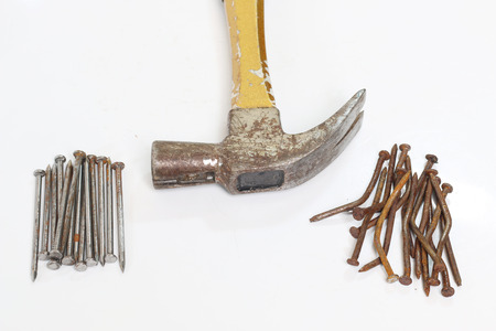 Hammers and nails on a white background.