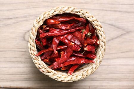 dried red chili on wooden tableの写真素材
