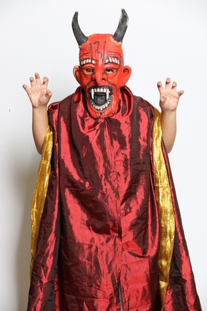 Boy in horror costume with mask isolated on white