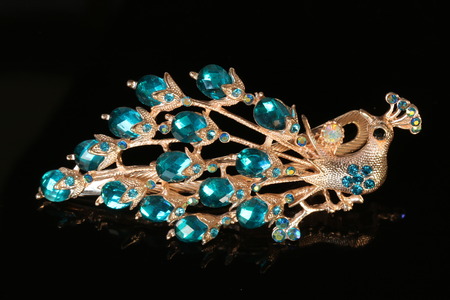 brooch jewelry isolated on black backgroundの写真素材