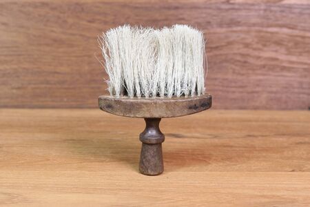vintage barber shaving brush On a wooden background.の写真素材