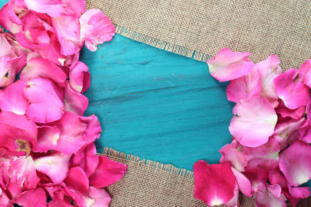 Rose petals on the green wood.の写真素材