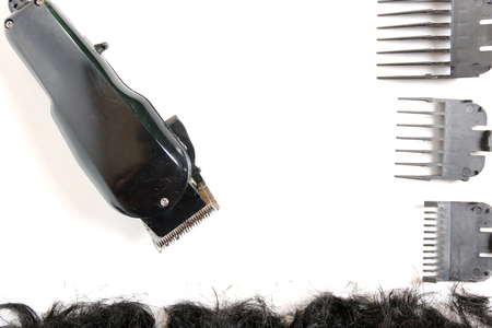 Hairclipper electricity with hairs on a white background.