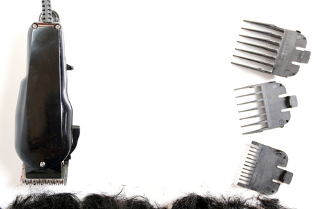 Hairclipper electricity with hairs on a white background.の写真素材