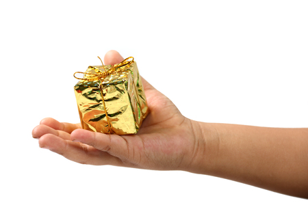 Gift box in hand boy on a white background.の写真素材