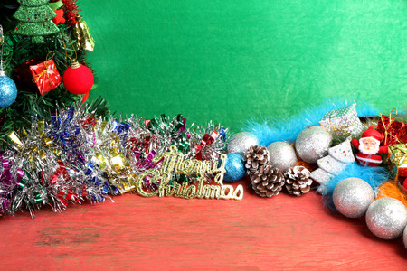 Christmas decorations on the wooden floor of red on a green background.の写真素材