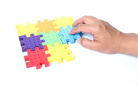 Jigsaw puzzle in handsの写真素材