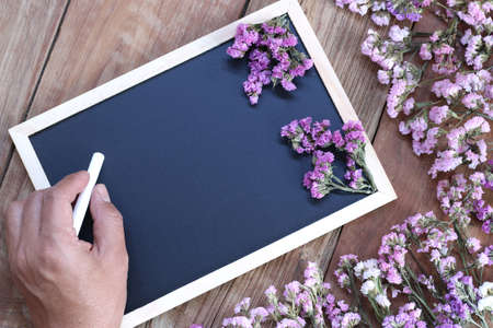 Man hand writing on the blackboard shock.の写真素材