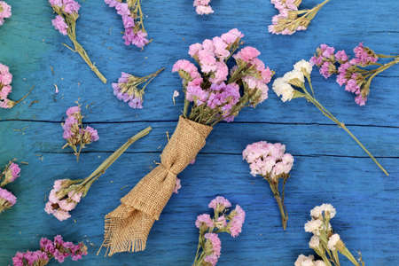 Beautiful flowers on blue wood.