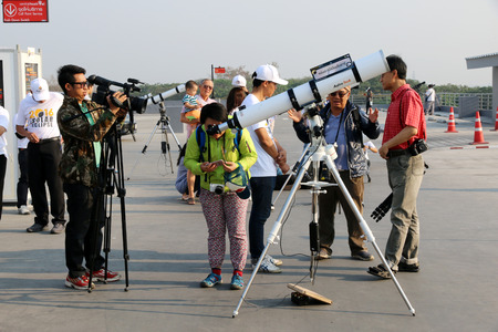 Chiangmai, Thailand - March 9, 2016: People watch the solar eclipse in Chiang Mai, Thailand.のeditorial素材