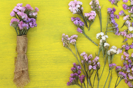 Beautiful flowers on yellow wood.の写真素材