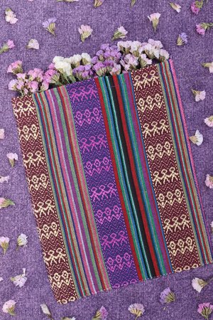 Beautiful flowers on a purple fabric.の写真素材