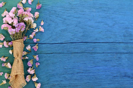 Beautiful flowers on blue wood.の写真素材