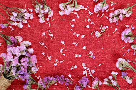 Beautiful flowers on a red fabric.
