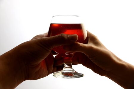 Men give women a glass of wine.の写真素材