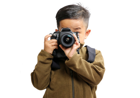 Boy with photocamera isolated on white background