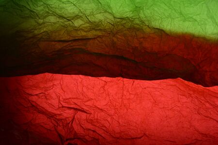 Texture of green and red striped crumpled paper for pattern backgroundの写真素材