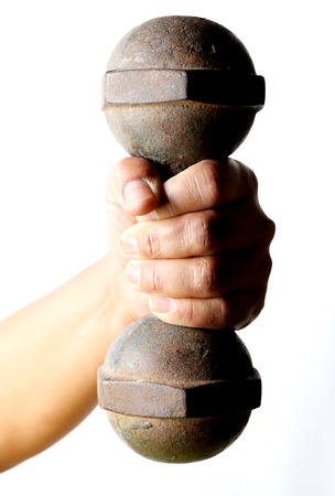 male hand is holding metal barbell isolated on white background.の写真素材