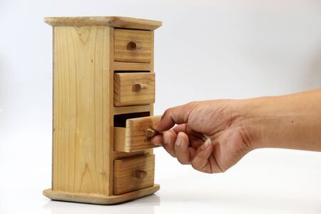 Hand-picked out of the drawer isolate on white background.の写真素材