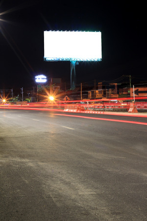 Blank billboard at night time for advertisement city street night lightの写真素材